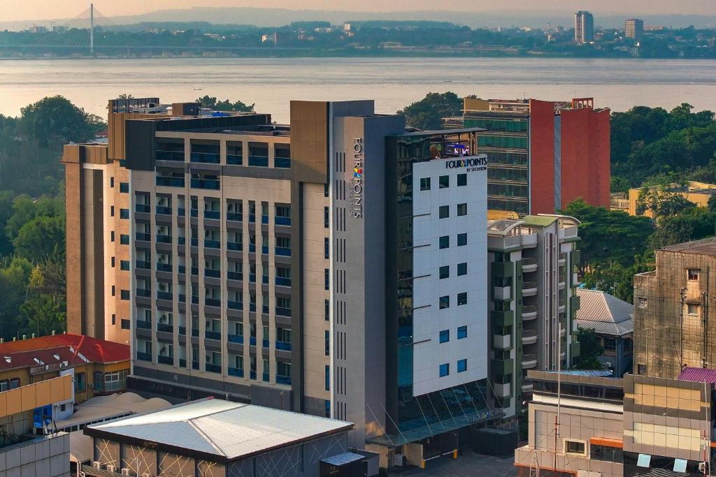 an aerial view of a city with a tall building at Four Points by Sheraton Kinshasa in Kinshasa