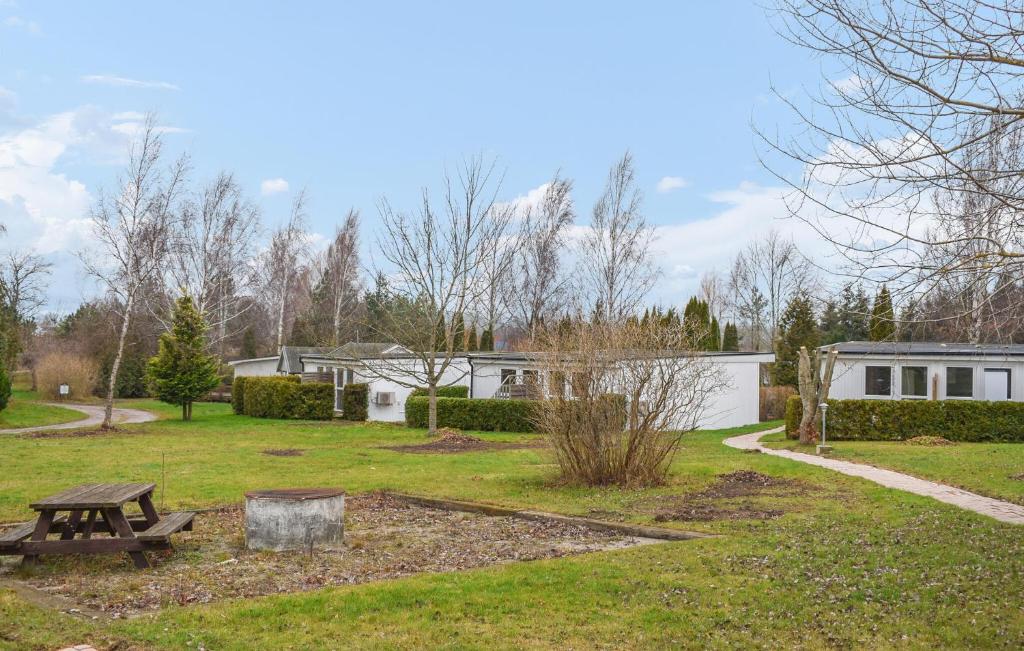 a park with a picnic table and a building at Gorgeous Home In Ystad in Ystad
