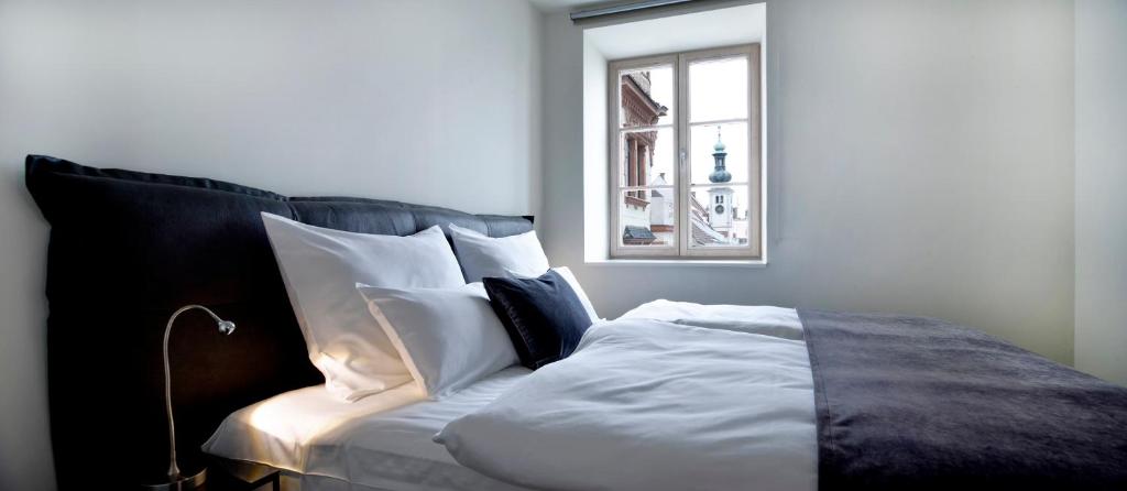 Voodi või voodid majutusasutuse Hotel Maribor, City apartments toas