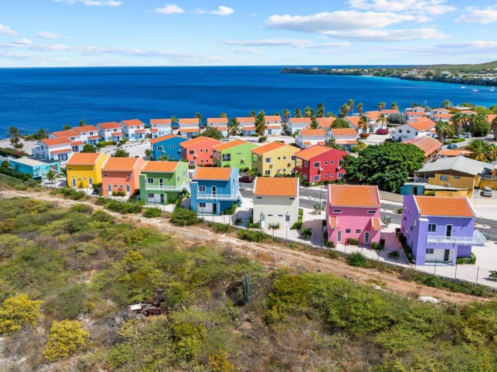 an aerial view of a town with the ocean at Serene Shores, Punta Azul, Westpunt in Westpunt