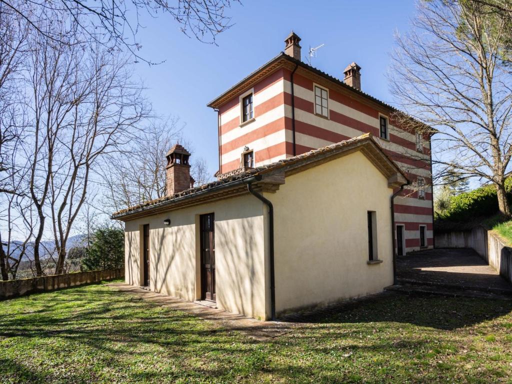 an old building with a tower on top of it at Mansion in Citerna with Pool & Garden in Citerna