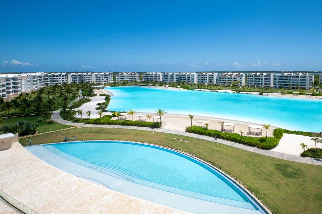 an overhead view of a large swimming pool at a resort at The Palms Boutique Hotel & Residence in Punta Cana