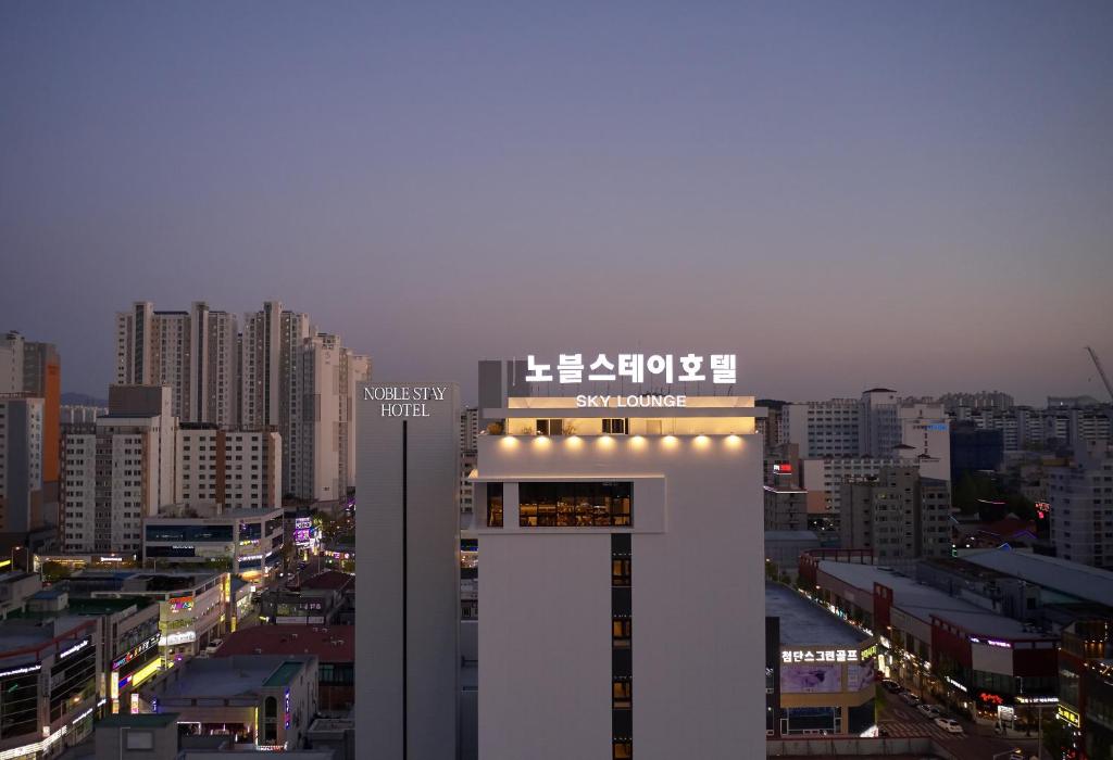 a view of a city at night with buildings at Noble Stay Hotel in Gwangju