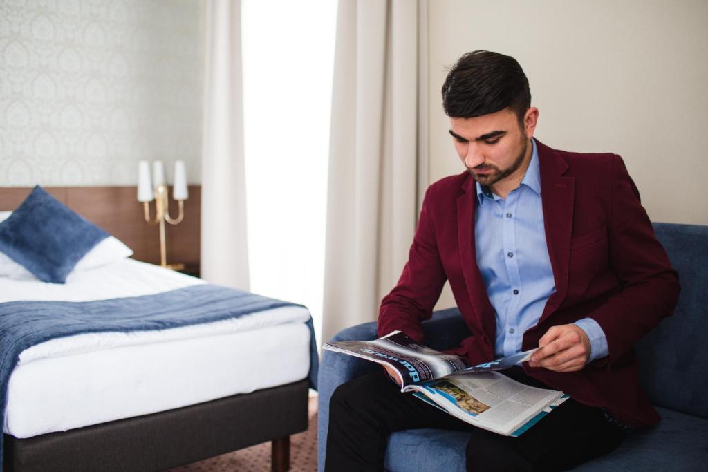 Posteľ alebo postele v izbe v ubytovaní Hotel Cztery Pory Roku