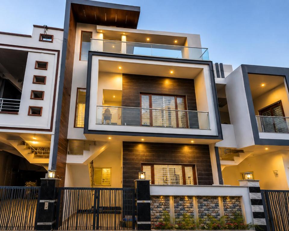 a building with two floors and a balcony at Palam Villa in Kharar