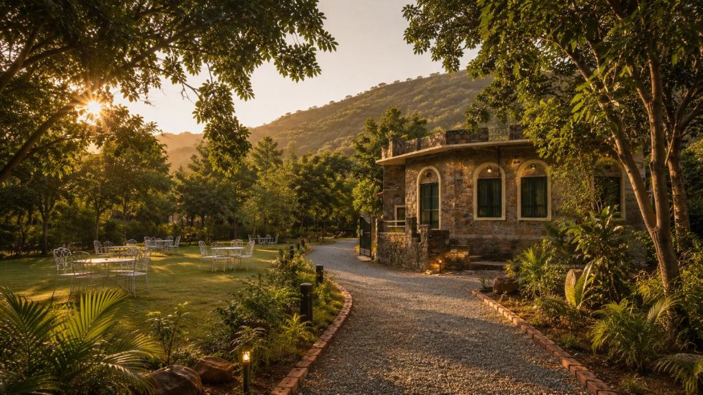 a house with a garden and a driveway at Sariska Forest Trail in Rāmsinghpura