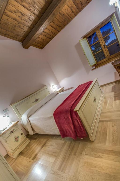 Postel nebo postele na pokoji v ubytování La Castellaia Resort