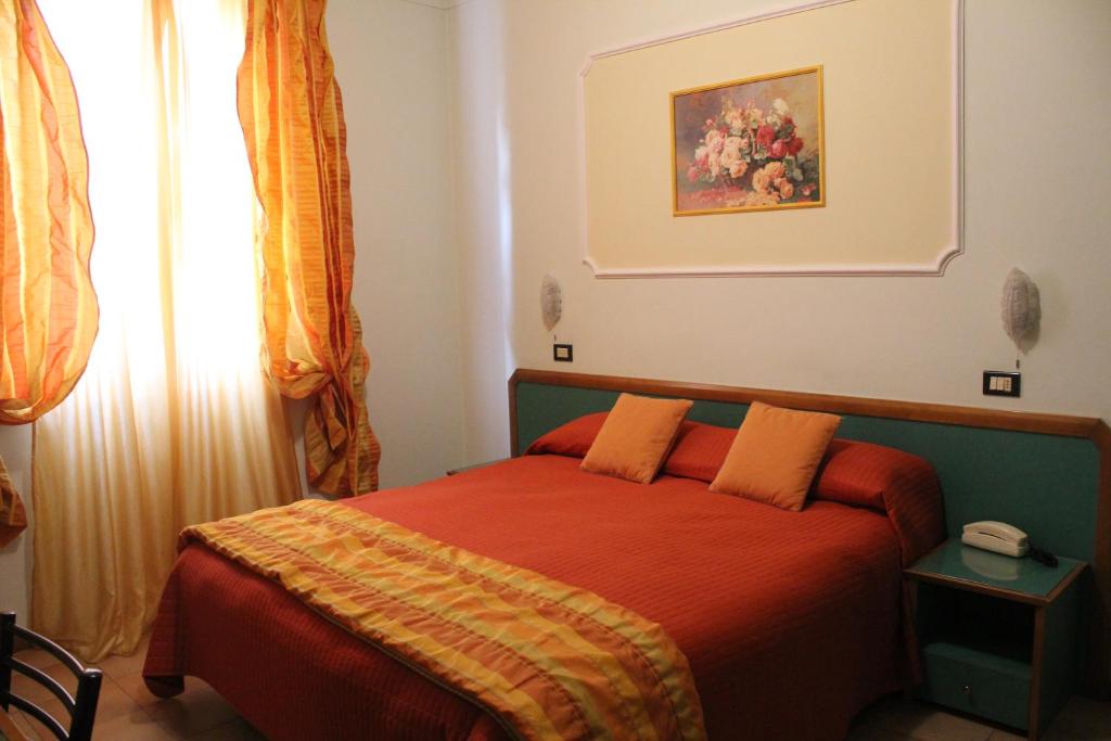 Postel nebo postele na pokoji v ubytování Hotel La Torre