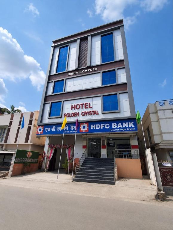 a hotel with a sign on the front of it at Hotel Golden Crystal Best Hotel in kankarbagh Patna in Patna
