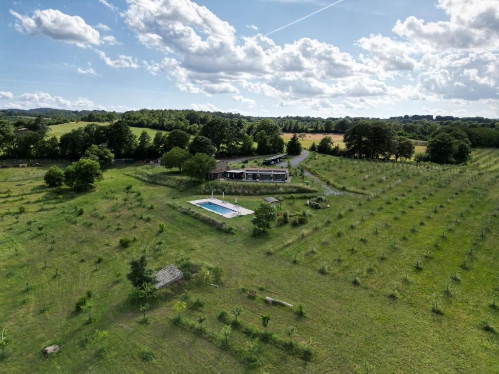 an aerial view of a farmhouse in a field at Podere l'Alfina B&B - Bio Agriturismo in Castel Giorgio