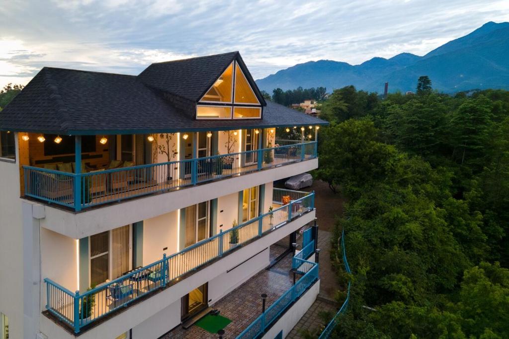 an aerial view of a building with a balcony at Water by The StayCationer in Dehradun