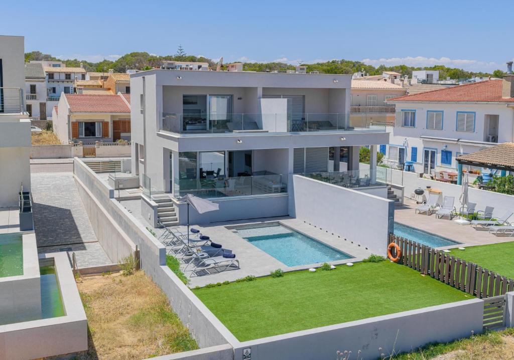 an aerial view of a house with a swimming pool at Son Serra Relax 2 By homevillas360 in Son Serra de Marina