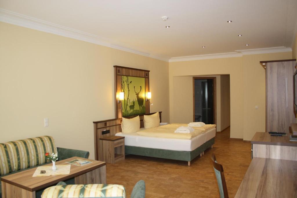 Postel nebo postele na pokoji v ubytování Wald-Hotel Heppe