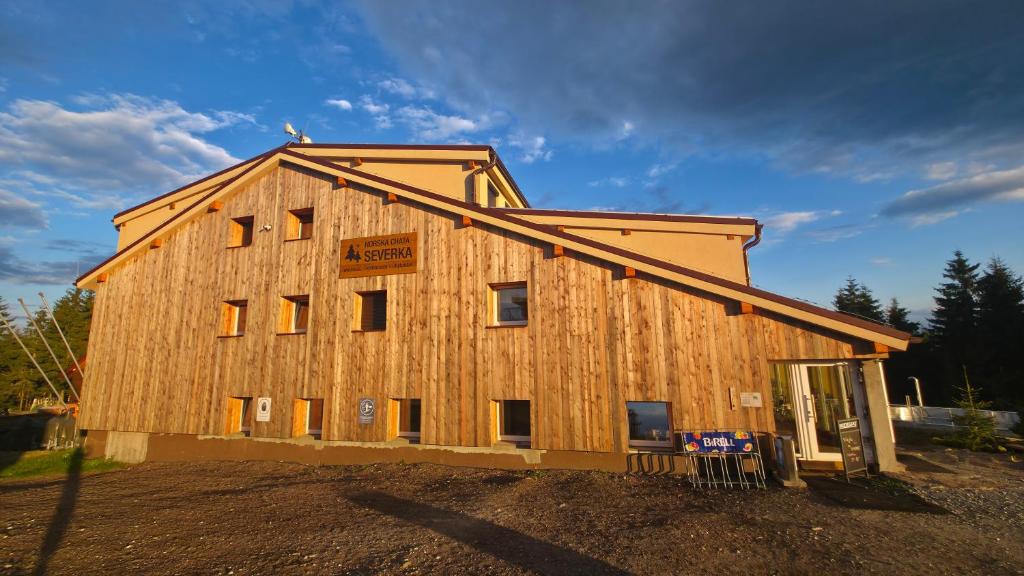 a house being constructed with the front of it at Horská chata Severka in Dolní Lomná