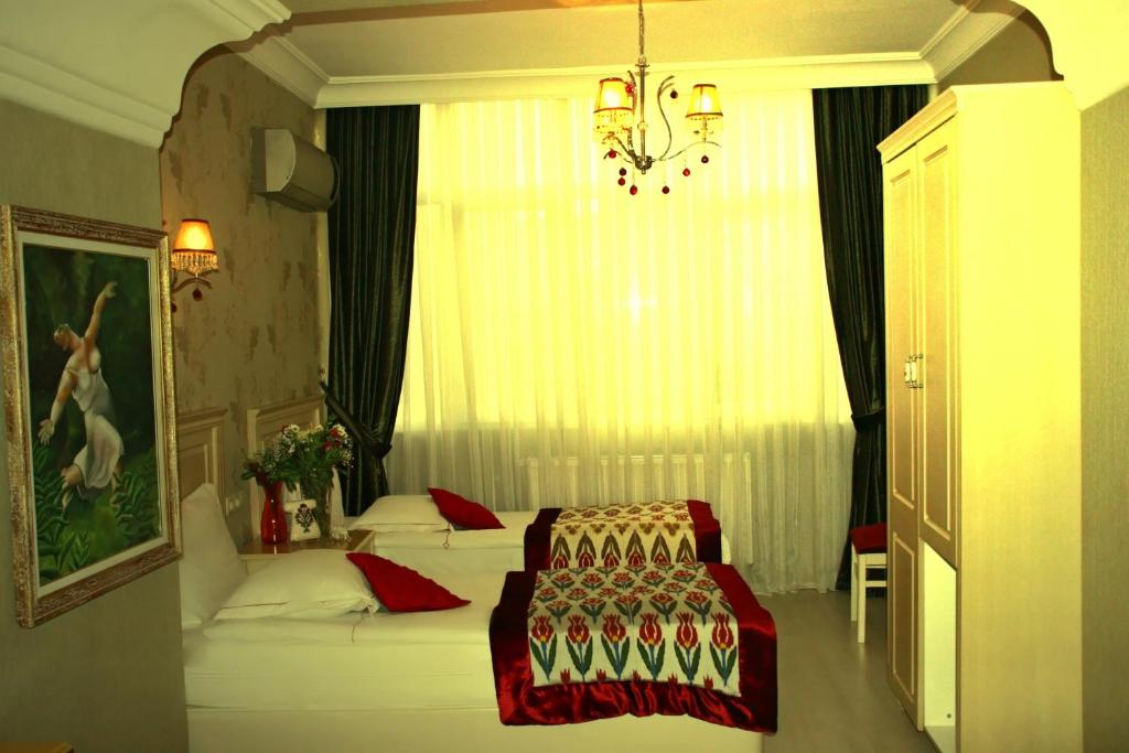 Postel nebo postele na pokoji v ubytování Divas Hotel