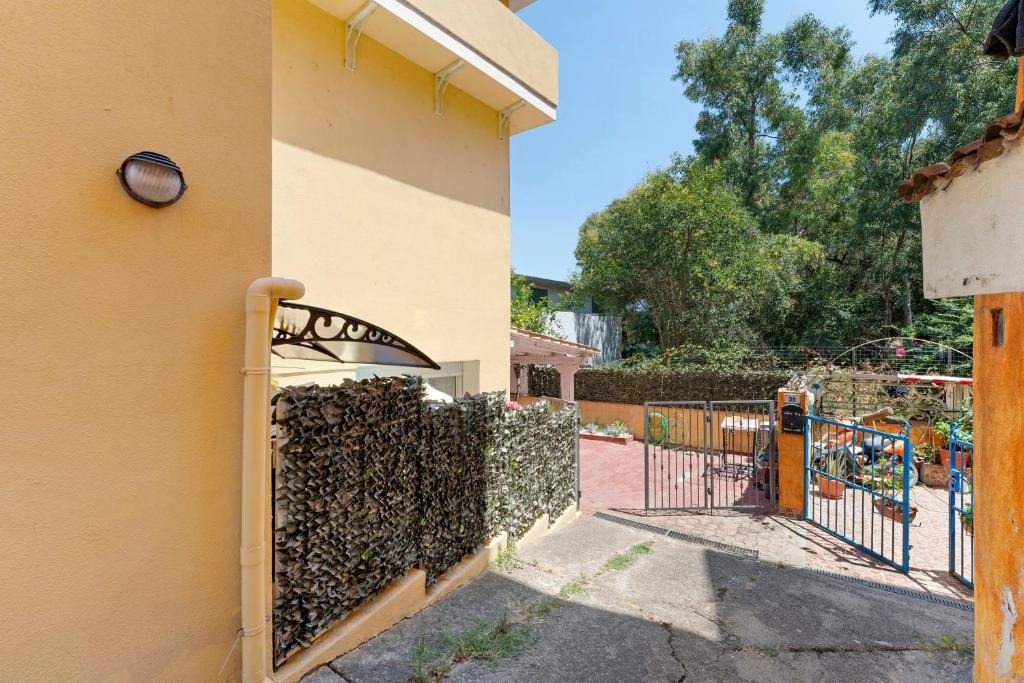 a gate to a house with a fence at Attico Bella Vista in Siniscola