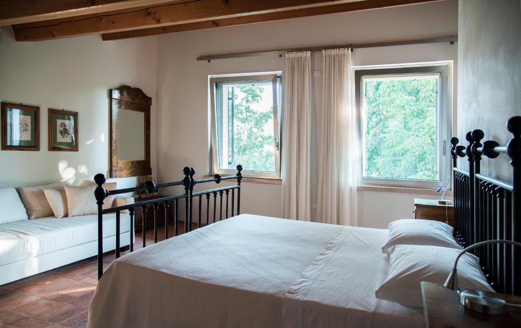 Postel nebo postele na pokoji v ubytování Agriturismo Corte Ruffoni