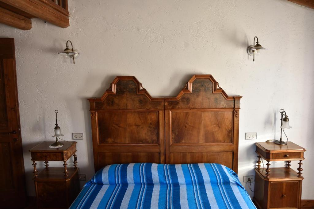 A bed or beds in a room at Ca Borgh