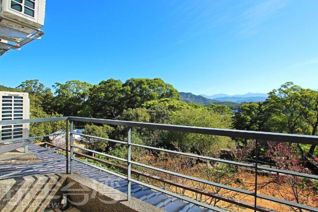 a balcony with a view of the mountains at 三義竺夢園 漫步山林 漫遊桐花 in Sanyi