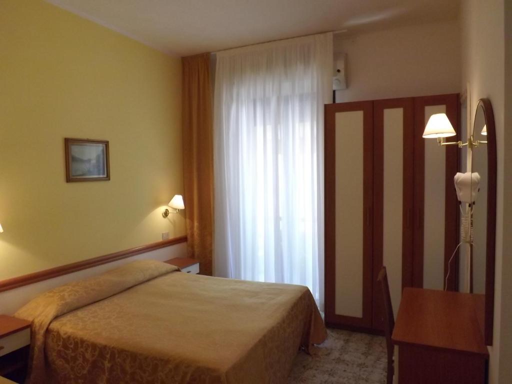 Postel nebo postele na pokoji v ubytování Hotel Vasco