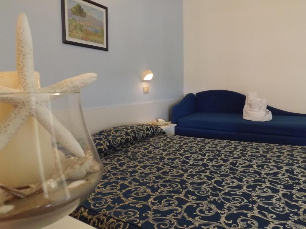 Postel nebo postele na pokoji v ubytování Hotel Vasco