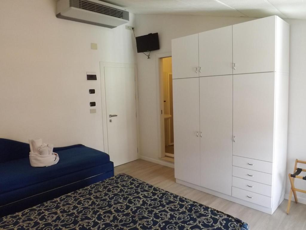 Postel nebo postele na pokoji v ubytování Hotel Vasco