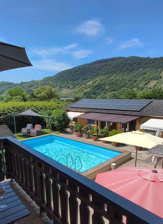 a view of a swimming pool on a balcony at Moselferienweingut Schaefer in Wintrich