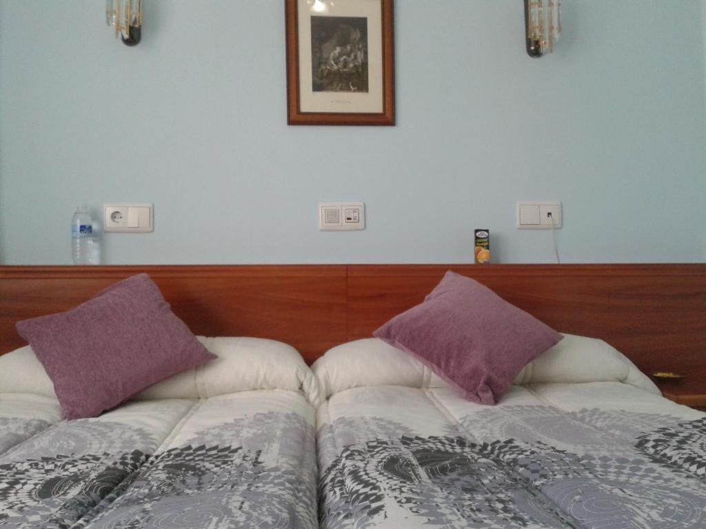 Posteľ alebo postele v izbe v ubytovaní Hostal Campus