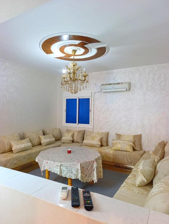 a living room with a couch and a table at Comfort Apartment in Einzorene