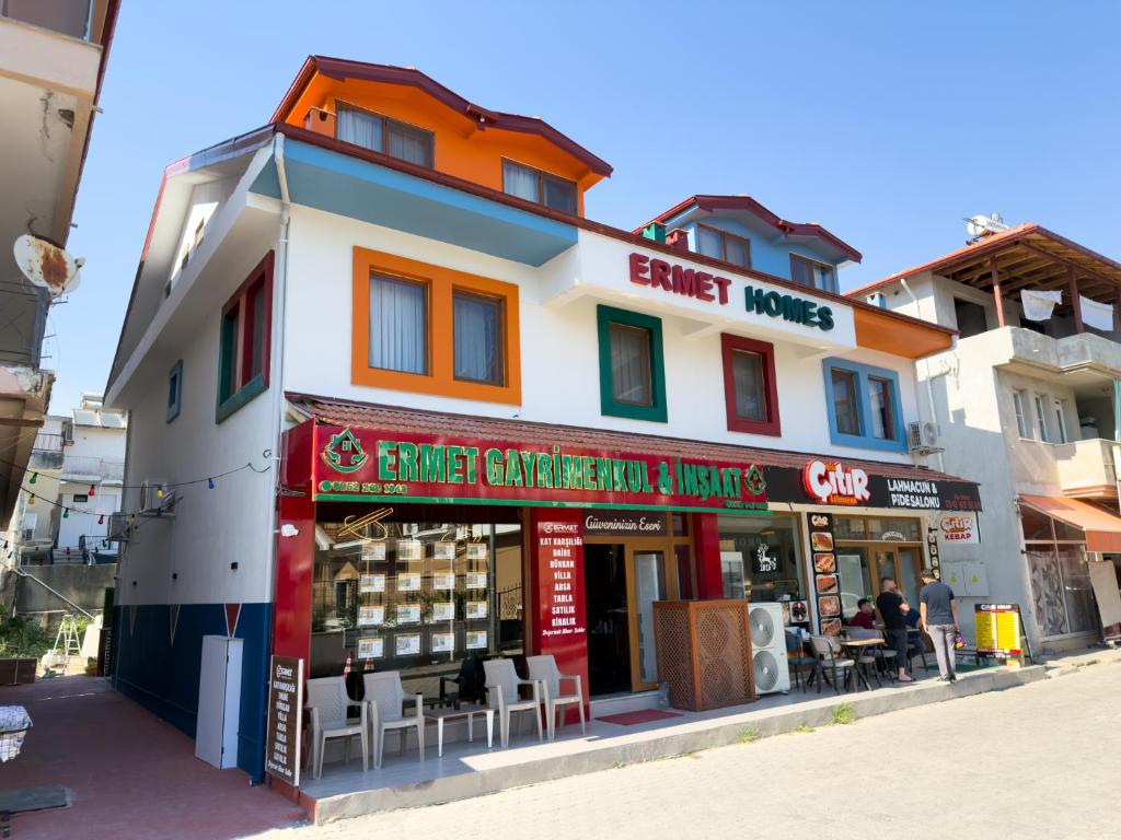a store front of a building on a street at Ermet Homes Apart in Koycegiz