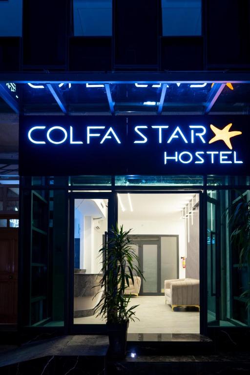 a blue sign for a cola star hospital at COLFA STAR Hostel in Bejaïa
