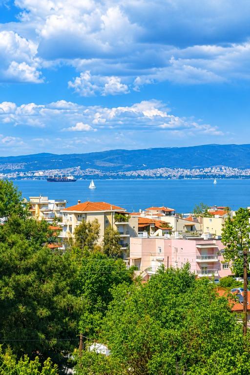a view of a city and a body of water at Little Villa - walk to the beach in Thessaloniki