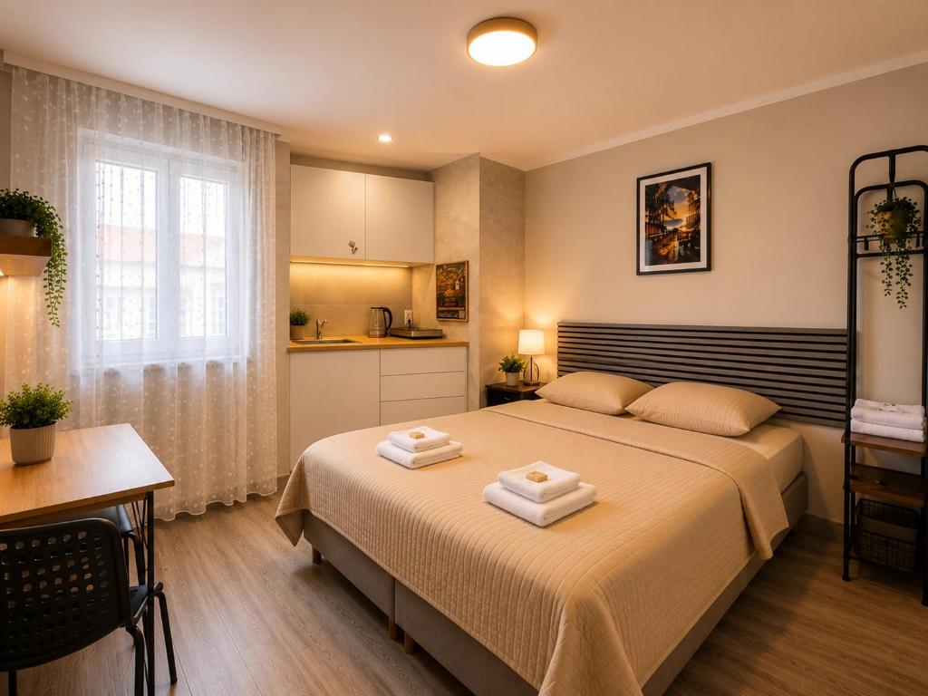 a bedroom with a bed with two towels on it at Modern Living Apartment Hotel in Nuremberg