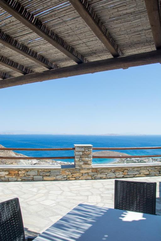 a patio with a view of the ocean at Villa Anemelia Tinos in Agios Ioannis