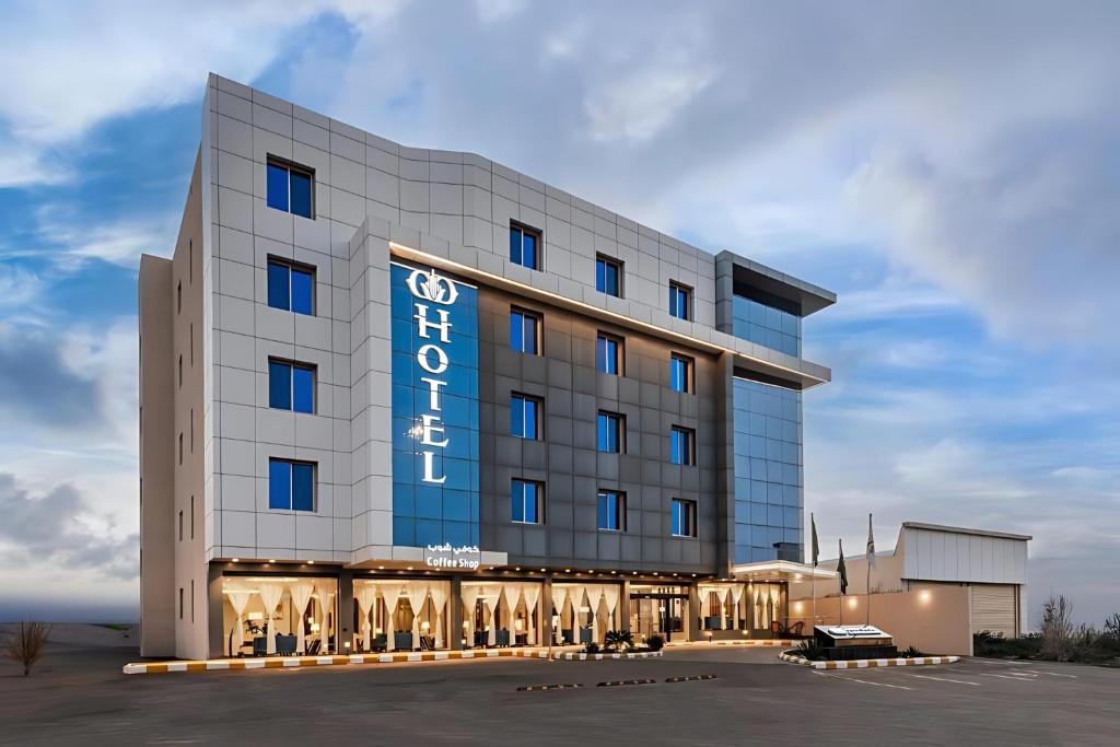 a hotel with a sign on the front of it at فندق اورا ميلينيوم in Al Maraghah