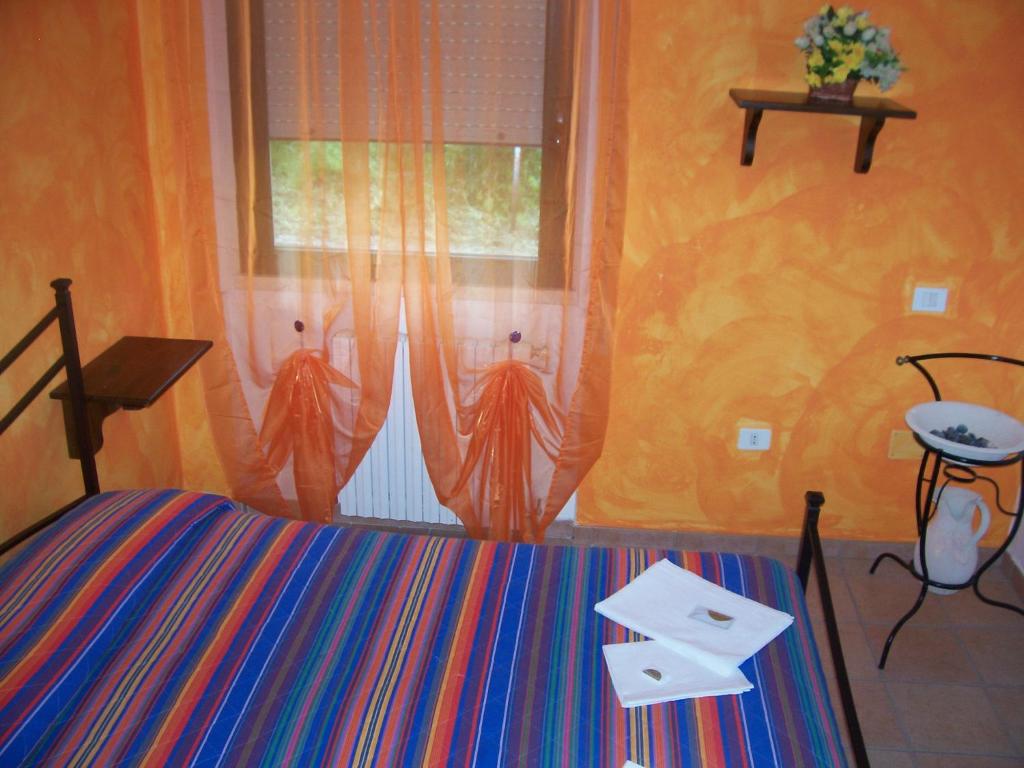 Postel nebo postele na pokoji v ubytování Ostello Del Volo