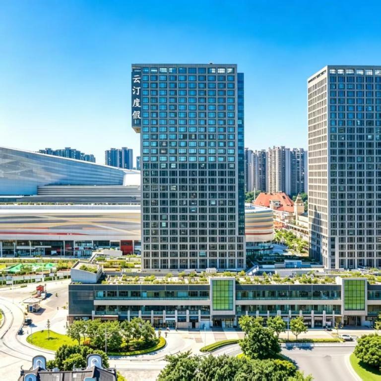 a group of tall buildings in a city at Yunting Resort in Huadu