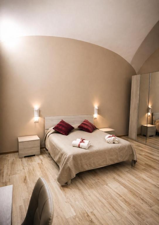 a bedroom with a bed with two pillows on it at Da Nonna Iolanda in Caiazzo