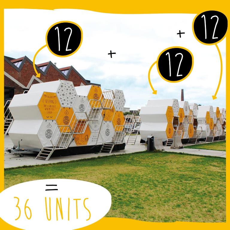 a picture of two large buildings with the number six units at Slaaptrailer MXGP Arnhem in Arnhem