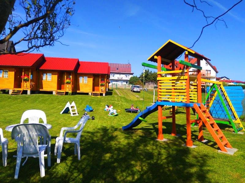 a playground with a slide and a play structure at Pelikan in Sianozety