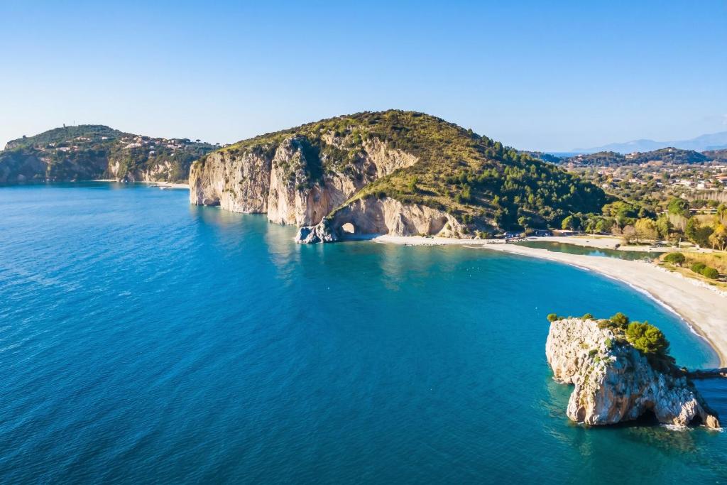 an aerial view of a beach with a rock in the water at Charming Apartment in Pisciotta with Terrace and Parking in Pisciotta