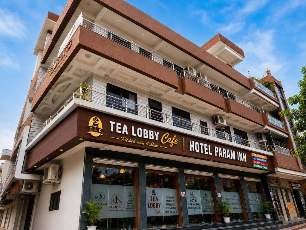a building with a tea lobby cafe on the street at Hotel Param INN in Gwalior