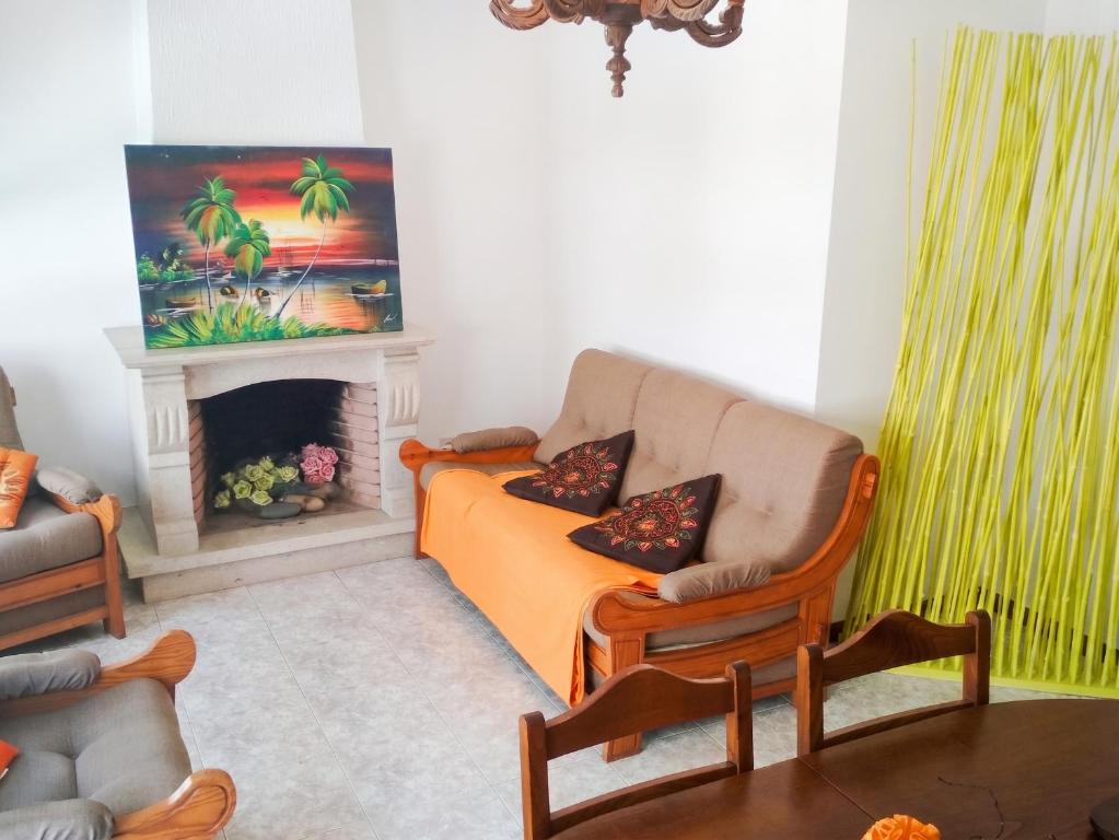a living room with a couch and a fireplace at Spacious Apartment in Espinho with Fireplace, 87 sqm in Espinho