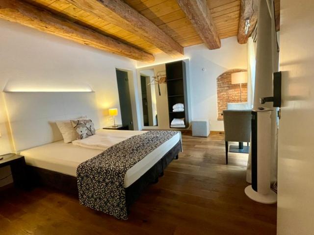 a bedroom with a large bed in a room at Hardthaus Gästezimmer in Kraiburg am Inn