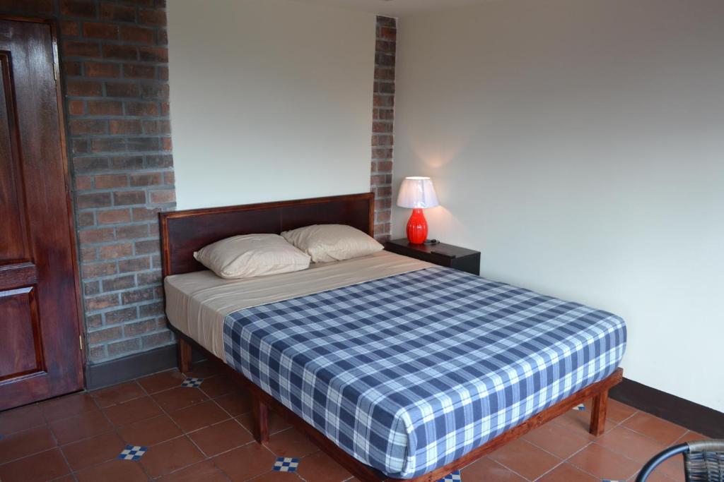 Postel nebo postele na pokoji v ubytování Hotel Columbus