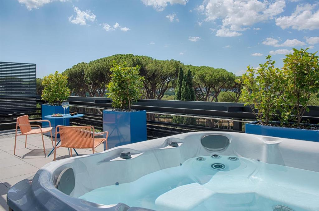 a bath tub sitting on top of a roof at nhow Roma Vittorio Veneto in Rome
