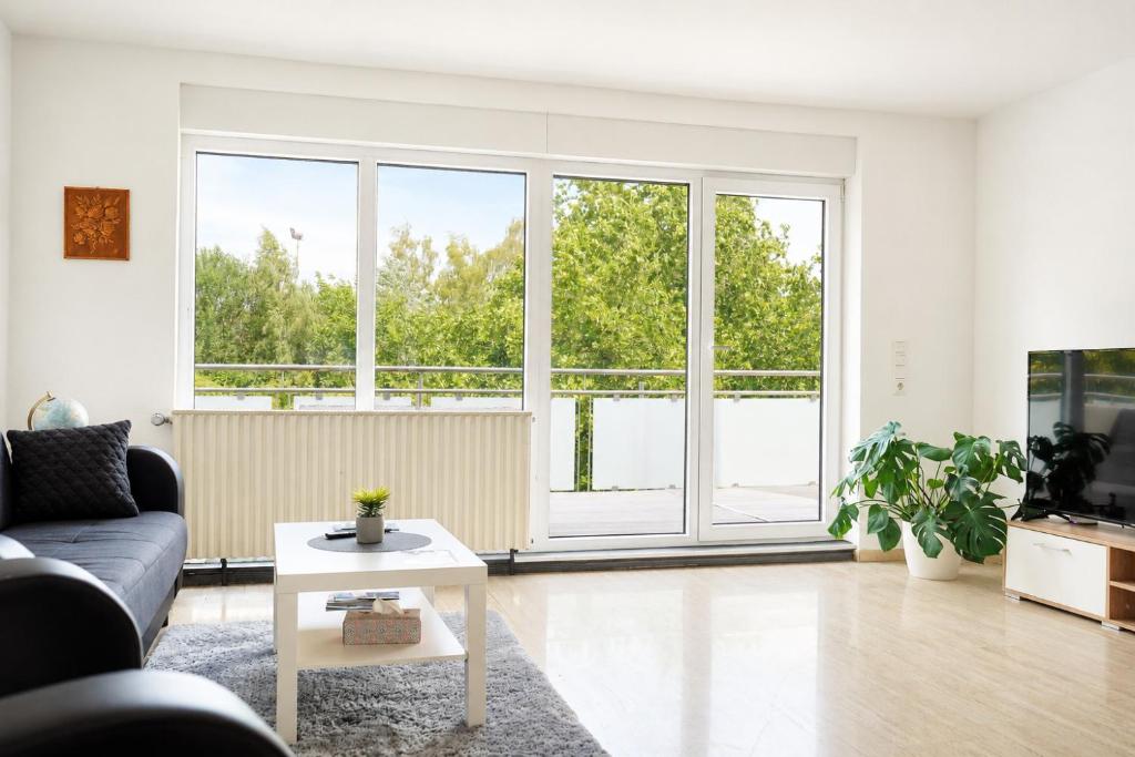 a living room with a couch and a table at Ferienwohnung Birke in Sankt Wendel