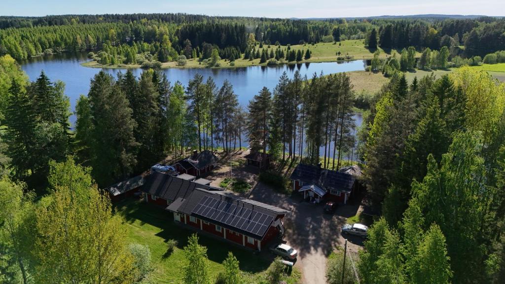 an aerial view of a house on the shore of a lake at Venetsianranta in Saarijärvi