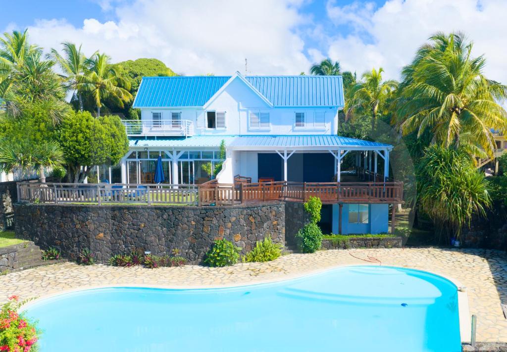 a house on the beach with a pool at THE BAY in Trou d'Eau Douce