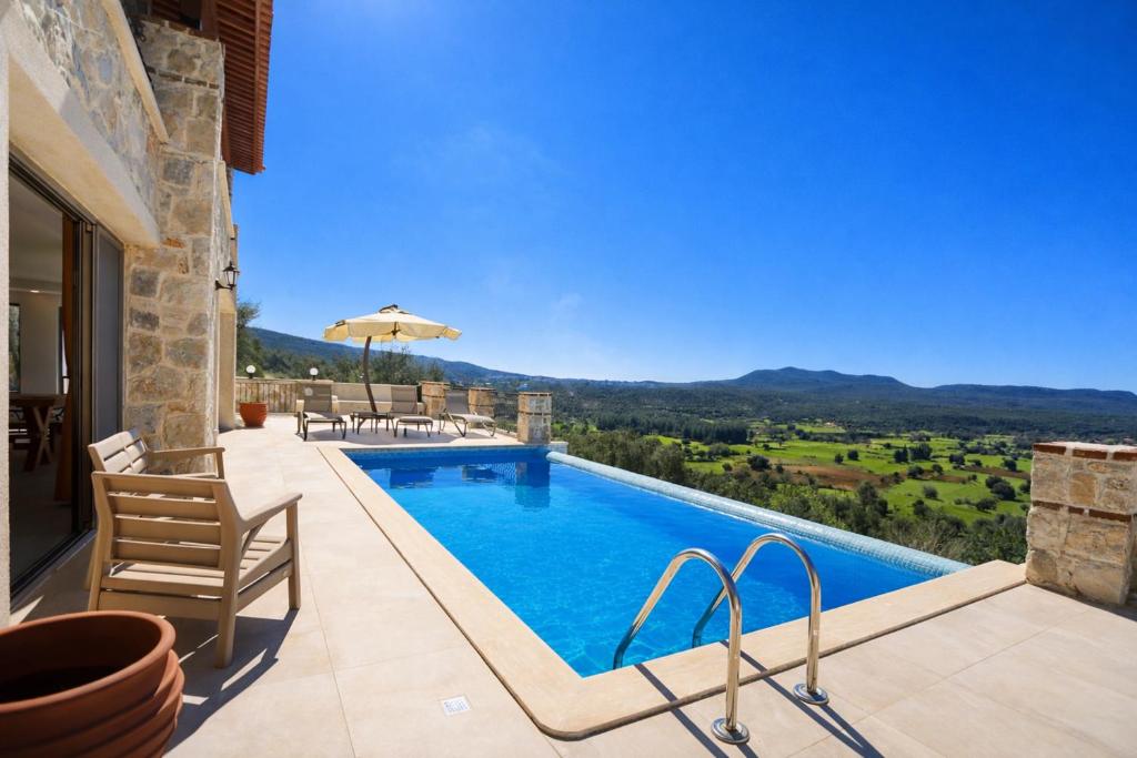 a villa with a swimming pool with a view at Villa Sydney in Kaş